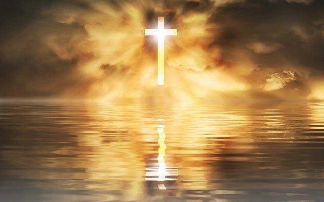 The Cross of Jesus shining like the sun above the sea