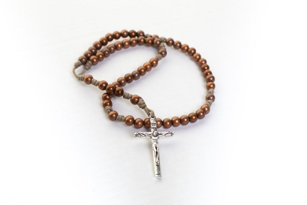 A rosary from Bishop Sheen rosaries, copper beads and a wooden-looking metal crucifix